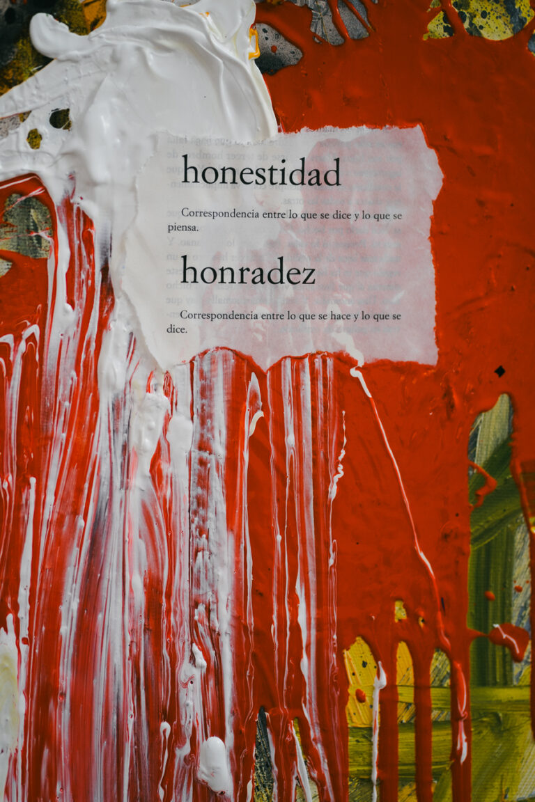 A torn paper scrap featuring Spanish definitions for honestidad and honradez is overlaid on a textured surface covered in dripping red and white paint.