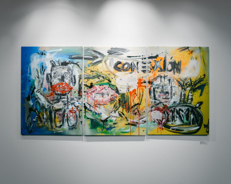 A triptych painting with abstract figures, expressive brushstrokes, and the word CONEXIÓN displayed across the panels, mounted on a white gallery wall.