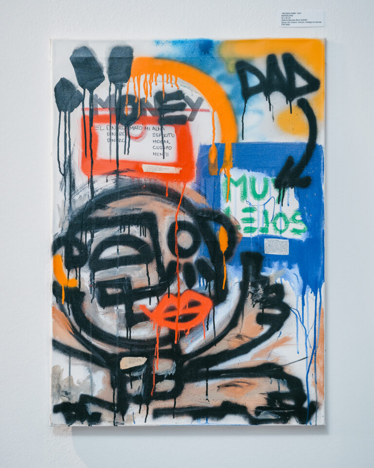 An abstract mixed-media painting featuring black, orange, and blue spray paint, text elements, and a stylized face on a white canvas.